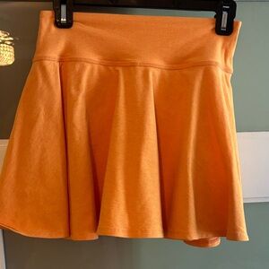 Orange Beyond Yoga tennis skirt